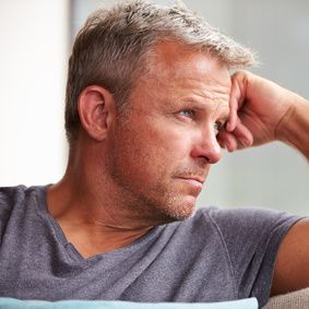 depressed man looking for natural hemorrhoids treatment